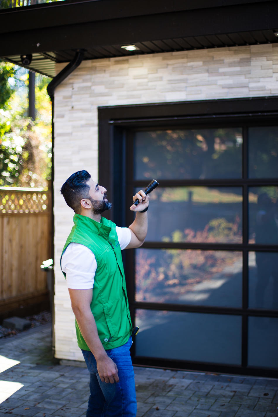 Home inspector checking the exterior of a house